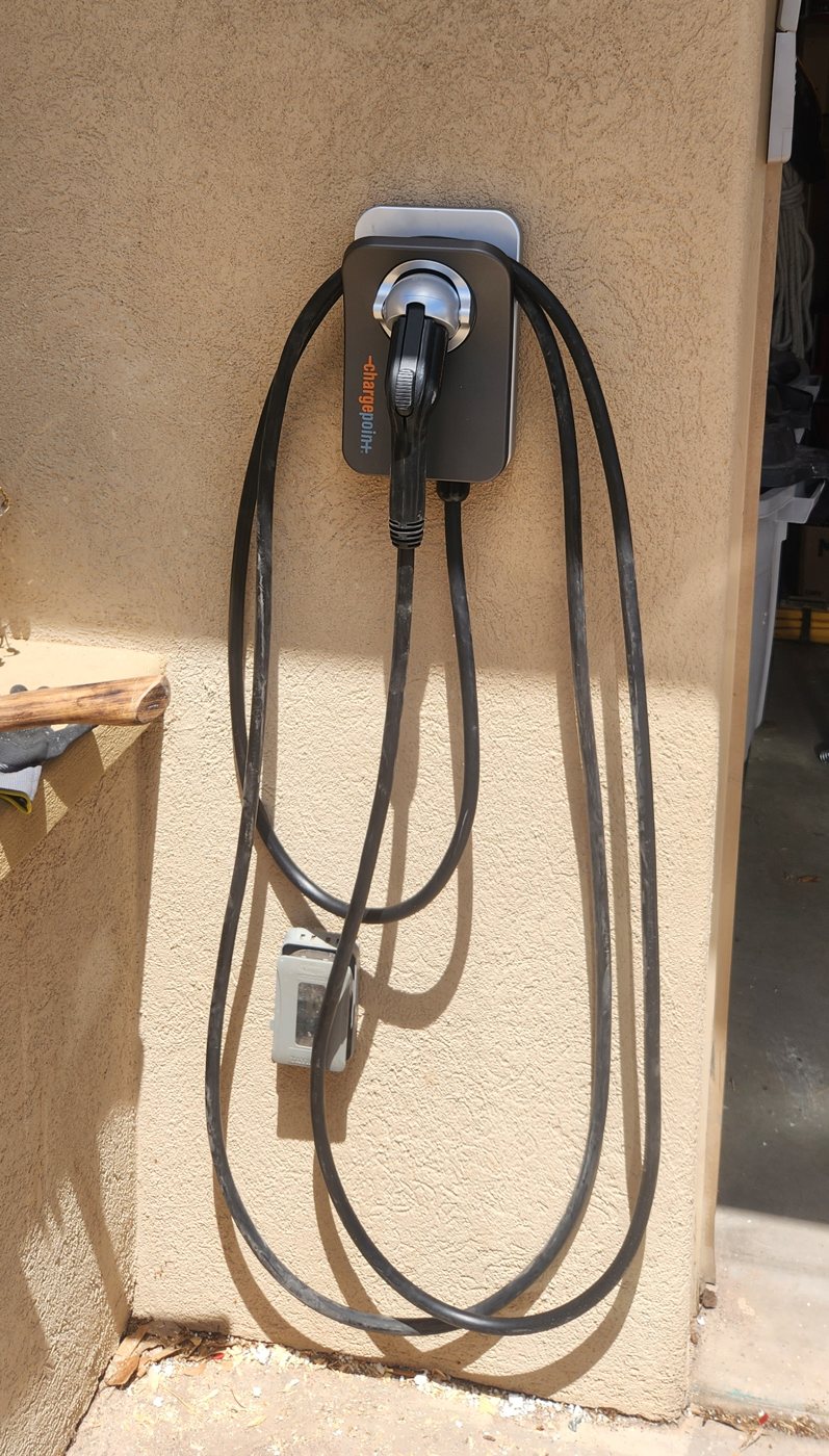 ChargePoint Home Flex mounted on an exterior stucco wall